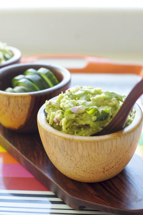 Lime-Lovin’ Guacamole (AIP Paleo, AI Keto) Lime-Lovin' Guacamole (AIP Paleo, AI Keto) Up close in brown bowl served with cucumber slices